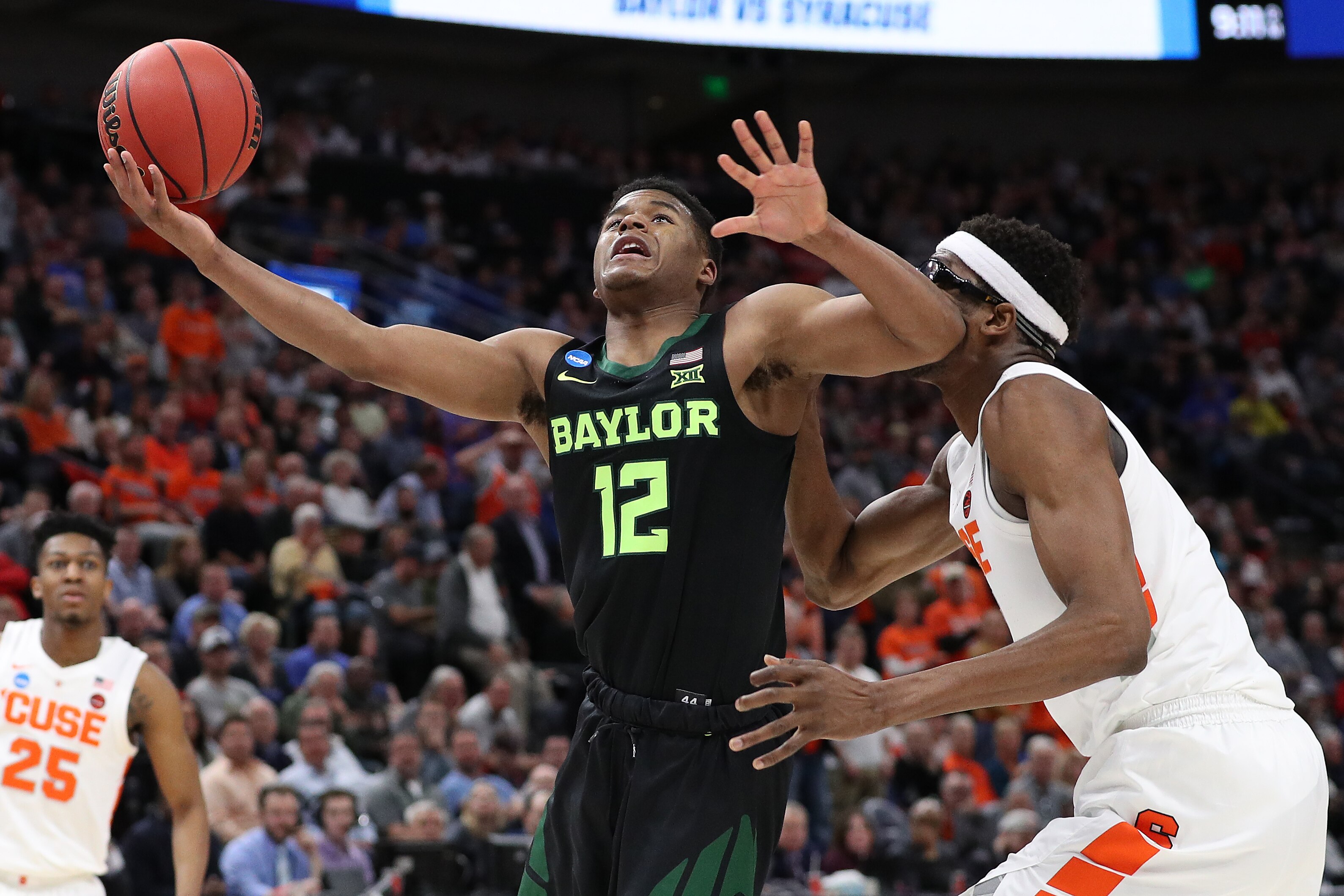 SALT LAKE CITY, UTAH - MARCH 21: Jared Butler #12 of the Baylor Bears shoots against Paschal Chukwu #13 of the Syracuse Orange during the second half in the first round of the 2019 NCAA Men's Basketball Tournament at Vivint Smart Home Arena on March 21, 2019 in Salt Lake City, Utah. (Photo by Patrick Smith/Getty Images)