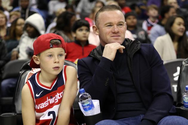WASHINGTON, DC - DECEMBER 01: DC United soccer player, and former Manchester United player, Wayne Rooney looks on from a court side seat with his son as the Brooklyn Nets play the Washington Wizards during the first half at Capital One Arena on December 01, 2018 in Washington, DC. NOTE TO USER: User expressly acknowledges and agrees that, by downloading and or using this photograph, User is consenting to the terms and conditions of the Getty Images License Agreement. (Photo by Patrick Smith/Getty Images)