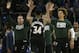 Milwaukee Bucks' Giannis Antetokounmpo (34) is congratulated by teammates after an NBA basketball game against the Boston Celtics Thursday, Feb. 21, 2019, in Milwaukee. The Bucks won 98-97. (AP Photo/Aaron Gash)