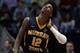 Murray State's Ja Morant (12) looks up at the scoreboard during the first half of a second round men's college basketball game against Florida State in the NCAA Tournament, Saturday, March 23, 2019, in Hartford, Conn. (AP Photo/Elise Amendola)