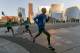 Los Angeles Marathon Elite runners, from left, Weldon Kirui, Simon Njoroge, Elisha Barno race past the Walt Disney Concert Hall in Los Angeles Sunday, March 18, 2018. Kirui won the Los Angeles Marathon with an unofficial time of 2 hours 11 minutes and 47 seconds. (AP Photo/Damian Dovarganes)
