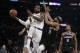 Los Angeles Lakers' LeBron James, left, makes a behind-the-back pass as Sacramento Kings' Corey Brewer (33) defends during the first half of an NBA basketball game Sunday, March 24, 2019, in Los Angeles. (AP Photo/Marcio Jose Sanchez)