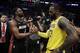 Miami Heat guard Dwyane Wade, left, shakes hands with Los Angeles Lakers' LeBron James at the end of an NBA basketball game Monday, Dec. 10, 2018, in Los Angeles. (AP Photo/Marcio Jose Sanchez)