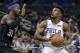 Philadelphia 76ers' Jimmy Butler, right, looks to shoot over Orlando Magic's Terrence Ross (31) during the first half of an NBA basketball game, Monday, March 25, 2019, in Orlando, Fla. (AP Photo/John Raoux)