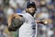FILE - In this Oct. 17, 2018, file photo, Los Angeles Dodgers starting pitcher Clayton Kershaw throws during the first inning of Game 5 of the baseball NL Championship Series game against the Milwaukee Brewers in Los Angeles. Kershaw and the Dodgers want some more time to consider their possible future together. The three-time NL Cy Young Award winner and the team have agreed to extend the deadline on his option decision by 40 hours until 1 p.m. PDT Friday. (AP Photo/Jae Hong, File)