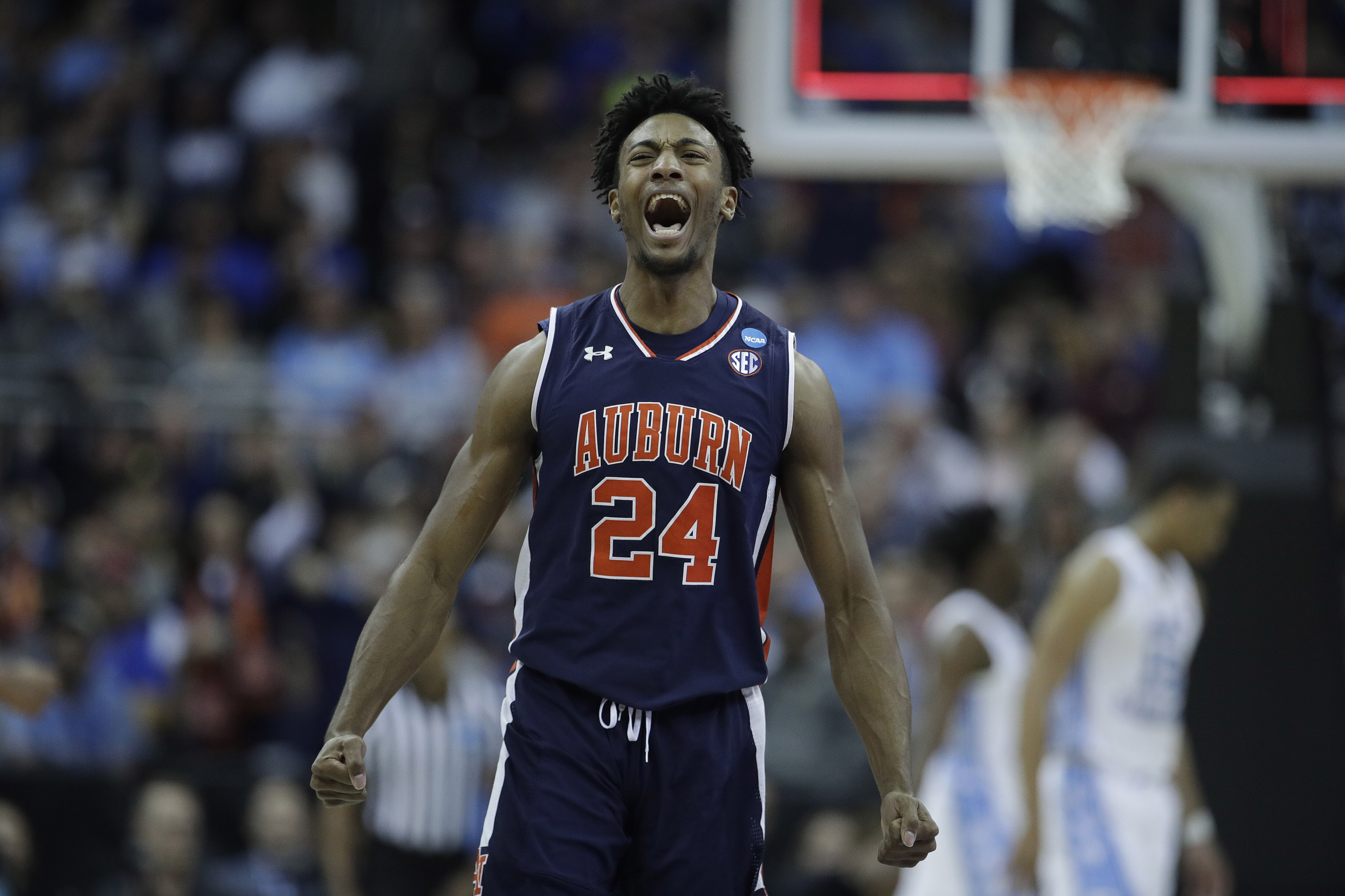 Auburn's Anfernee McLemore celebrates at the end of the first half of a men's NCAA tournament college basketball Midwest Regional semifinal game against North Carolina Friday, March 29, 2019, in Kansas City, Mo. (AP Photo/Charlie Riedel)