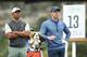 AUSTIN, TEXAS - MARCH 30: Tiger Woods of the United States and Rory McIlroy of Northern Ireland stand on the 13th tee during the fourth round of the World Golf Championships-Dell Technologies Match Play at Austin Country Club on March 30, 2019 in Austin, Texas. (Photo by Ezra Shaw/Getty Images)