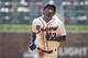 Atlanta Braves' Ronald Acuna Jr. approached third base on his home run hit to left field during the second inning of a baseball game against the Milwaukee Brewers, Sunday August 12, 2018, in Atlanta. (AP Photo/John Amis)