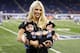 Kelly Stafford, wife of Detroit Lions quarterback Matthew Stafford holds the couple's twins Sawyer, left, and Chandler during pre-game of an NFL football game against the Atlanta Falcons, Sunday, Sept. 24, 2017, in Detroit. (AP Photo/Rick Osentoski)