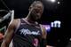 Miami Heat guard Dwyane Wade (3) reacts after he shoots against Phoenix Suns guard Jamal Crawford (11) and Phoenix Suns forward Mikal Bridges (25) during the second half of an NBA basketball game on Monday, Feb. 25, 2019, in Miami, Fla. (AP Photo/Brynn Anderson)
