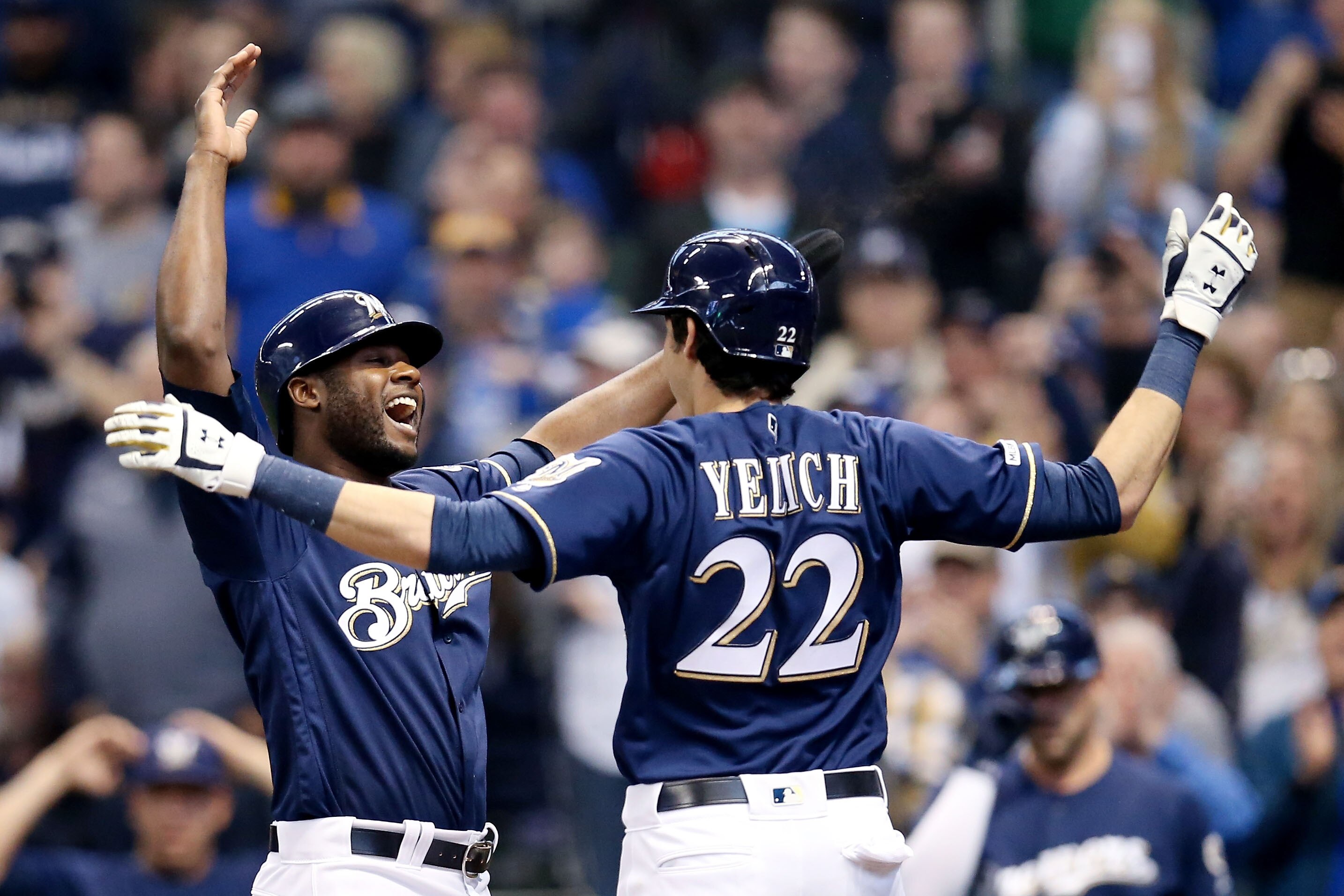 MILWAUKEE, WISCONSIN - APRIL 07:  Lorenzo Cain #6 and Christian Yelich #22 of the Milwaukee Brewers celebrate after Yelich hit a home run in the first inning against the Chicago Cubs at Miller Park on April 07, 2019 in Milwaukee, Wisconsin. (Photo by Dylan Buell/Getty Images)