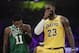 Los Angeles Lakers' LeBron James, right, and Boston Celtics' Kyrie Irving chat with their mouths covered during the first half of an NBA basketball game, Saturday, March 9, 2019, in Los Angeles. (AP Photo/Jae C. Hong)