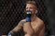 FILE - In this Jan. 20, 2019 file photo, TJ Dillashaw reacts after a flyweight mixed martial arts championship bout against Henry Cejudo at UFC Fight Night in New York. Dillashaw has surrendered the UFC 135-pound championship because of an “adverse finding” in his last drug test. Dillashaw posted on social media that he would give up the belt after he was informed by the New York State Athletic Commission and the United States Anti-Doping Agency of the results of his test leading up to his last fight in January. Dillashaw suffered first-round loss to Henry Cejudo and failed to become a two-division champion. (AP Photo/Frank Franklin II, File)