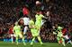 Barcelona's German goalkeeper Marc-Andre Ter Stegen (R) makes a save during the UEFA Champions league first leg quarter-final football match between Manchester United and Barcelona at Old Trafford in Manchester, north west England, on April 10, 2019. (Photo by LLUIS GENE / AFP) (Photo credit should read LLUIS GENE/AFP/Getty Images)