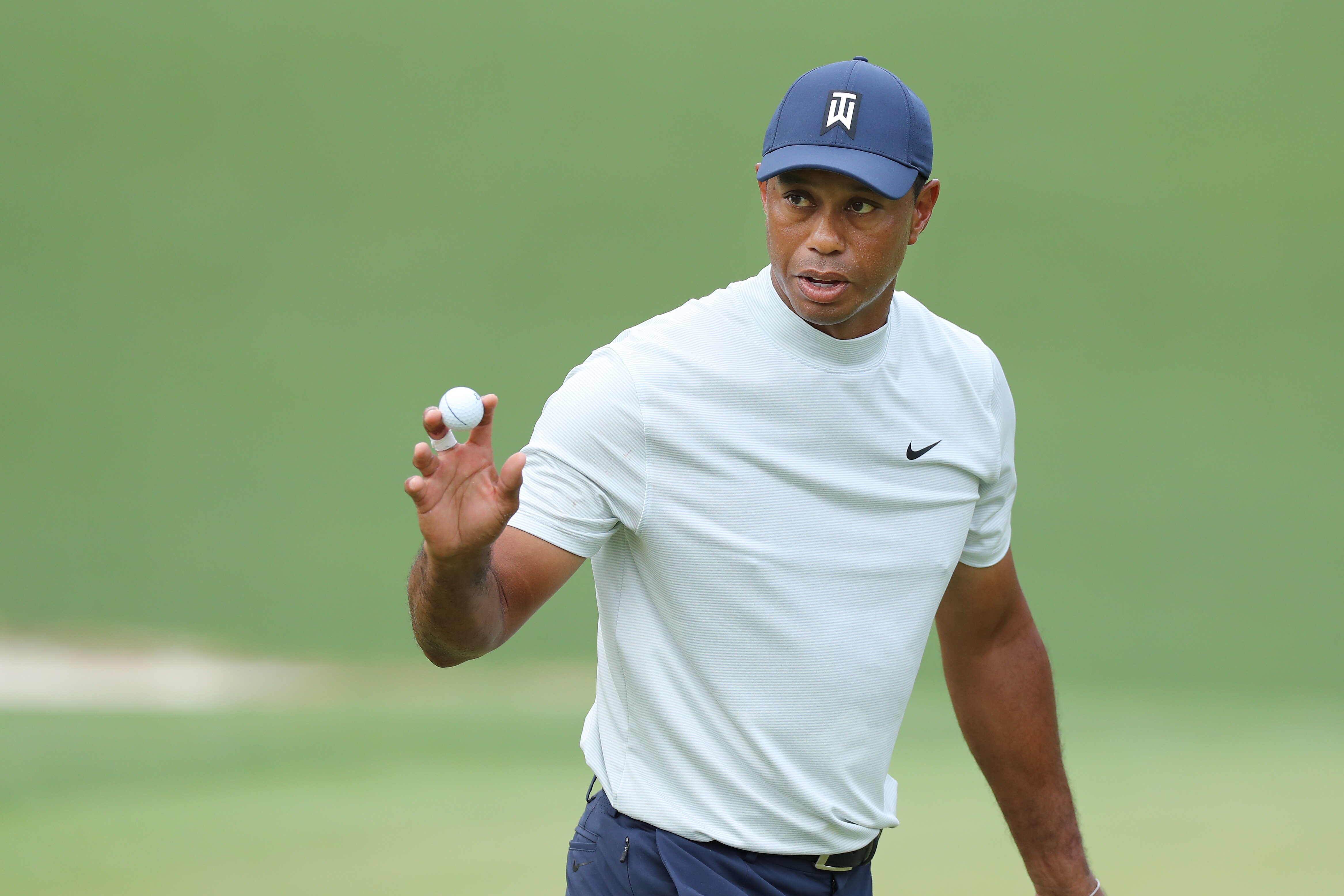 AUGUSTA, GEORGIA - APRIL 12: Tiger Woods of the United States acknowledges patrons on the 10th green during the second round of the Masters at Augusta National Golf Club on April 12, 2019 in Augusta, Georgia. (Photo by David Cannon/Getty Images)
