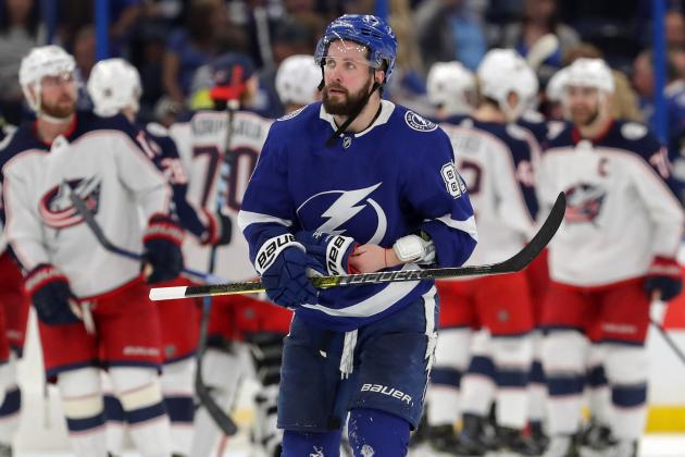 TAMPA, FL - APRIL 10: Nikita Kucherov #86 of the Tampa Bay Lightning reacts as members of the Columbus Blue Jackets celebrate at the end of Game One of the Eastern Conference First Round during the 2019 NHL Stanley Cup Playoffs at Amalie Arena on April 10, 2019 in Tampa, Florida. (Photo by Mike Carlson/Getty Images)