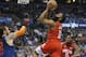 Houston Rockets guard James Harden (13) goes up for a shot between Oklahoma City Thunder center Steven Adams, left, and Rockets' Clint Capela (15) during the first half of an NBA basketball game Tuesday, April 9, 2019, in Oklahoma City. (AP Photo/Sue Ogrocki)