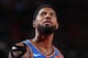 PORTLAND, OR - APRIL 14: Paul George #13 of the Oklahoma City Thunder looks on against the Portland Trail Blazers during Game One of Round One of the 2019 NBA Playoffs on April 14, 2019 at the Moda Center Arena in Portland, Oregon. NOTE TO USER: User expressly acknowledges and agrees that, by downloading and or using this photograph, user is consenting to the terms and conditions of the Getty Images License Agreement. Mandatory Copyright Notice: Copyright 2019 NBAE (Photo by Sam Forencich/NBAE via Getty Images)