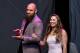 LAS VEGAS, NV - JULY 05: Mixed martial artist Travis Browne (L) walks onstage with his wife Ronda Rousey as she becomes the first female inducted into the UFC Hall of Fame at The Pearl concert theater at Palms Casino Resort on July 5, 2018 in Las Vegas, Nevada. (Photo by Ethan Miller/Getty Images)