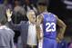 Philadelphia 76ers head coach Brett Brown, left, talks with Jimmy Butler (23) during the first half of an NBA basketball game against the Charlotte Hornets in Charlotte, N.C., Saturday, Nov. 17, 2018. (AP Photo/Chuck Burton)