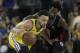 Golden State Warriors guard Stephen Curry, left, is defended by Los Angeles Clippers guard Patrick Beverley during the first half of Game 2 of a first-round NBA basketball playoff series in Oakland, Calif., Monday, April 15, 2019. (AP Photo/Jeff Chiu)