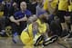Golden State Warriors center DeMarcus Cousins reacts after falling to the floor during the first half of Game 2 of a first-round NBA basketball playoff series against the Los Angeles Clippers in Oakland, Calif., Monday, April 15, 2019. (AP Photo/Jeff Chiu)