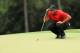 AUGUSTA, GEORGIA - APRIL 14: Tiger Woods of the United States lines up a putt on the 18th green during the final round of the Masters at Augusta National Golf Club on April 14, 2019 in Augusta, Georgia. (Photo by Mike Ehrmann/Getty Images)