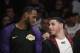 Los Angeles Lakers' LeBron James, left, talks to Lonzo Ball on the bench during the second half of an NBA basketball game against the Washington Wizards, Tuesday, March 26, 2019, in Los Angeles. The Lakers won 124-106. (AP Photo/Jae C. Hong)