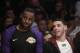 Los Angeles Lakers' LeBron James, left, and Lonzo Ball sit on the bench during the second half of an NBA basketball game against the Washington Wizards, Tuesday, March 26, 2019, in Los Angeles. (AP Photo/Jae C. Hong)