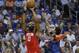 Houston Rockets guard James Harden (13) shoots as Oklahoma City Thunder forward Paul George, right, defends during the first half of an NBA basketball game Tuesday, April 9, 2019, in Oklahoma City. (AP Photo/Sue Ogrocki)