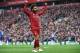 Liverpool's Egyptian midfielder Mohamed Salah celebrates after scoring their second goal during the English Premier League football match between Liverpool and Chelsea at Anfield in Liverpool, north west England on April 14, 2019. (Photo by Paul ELLIS / AFP) / RESTRICTED TO EDITORIAL USE. No use with unauthorized audio, video, data, fixture lists, club/league logos or 'live' services. Online in-match use limited to 120 images. An additional 40 images may be used in extra time. No video emulation. Social media in-match use limited to 120 images. An additional 40 images may be used in extra time. No use in betting publications, games or single club/league/player publications. / (Photo credit should read PAUL ELLIS/AFP/Getty Images)