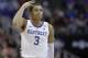 Kentucky's Keldon Johnson celebrates after making a 3-point basket during the first half of a men's NCAA tournament college basketball Midwest Regional semifinal game against Houston Friday, March 29, 2019, in Kansas City, Mo. (AP Photo/Charlie Riedel)