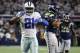 Dallas Cowboys running back Ezekiel Elliott (21) celebrates running the ball for a first down in front of Seattle Seahawks linebacker K.J. Wright (50) during an NFC wild-card NFL football game in Arlington, Texas, Saturday, Jan. 5, 2019.(AP Photo/Ron Jenkins)