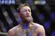 Conor McGregor reacts after losing to Khabib Nurmagomedov in a lightweight title mixed martial arts bout at UFC 229 in Las Vegas, Saturday, Oct. 6, 2018. Nurmagomedov won the fight by submission during the fourth round to retain the title. (AP Photo/John Locher)