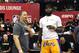 LAS VEGAS, NV - JULY 15: Head coach Tyronn Lue (L) of the Cleveland Cavaliers talks with LeBron James of the Los Angeles Lakers after a quarterfinal game of the 2018 NBA Summer League between the Lakers and the Detroit Pistons at the Thomas & Mack Center on July 15, 2018 in Las Vegas, Nevada. NOTE TO USER: User expressly acknowledges and agrees that, by downloading and or using this photograph, User is consenting to the terms and conditions of the Getty Images License Agreement. (Photo by Ethan Miller/Getty Images)