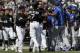 Chicago White Sox's Tim Anderson (7) is restrained by Jose Abreu after he was hit by a pitch from the Kansas City Royals, as benches cleared during the sixth inning of a baseball game in Chicago, Wednesday, April 17, 2019. The Royals won 4-3 in 10 innings. (AP Photo/Nam Y. Huh)