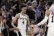 San Antonio Spurs guard Derrick White (4) celebrates a score against the Denver Nuggets with teammates during the first half of Game 3 of an NBA basketball playoff series in San Antonio, Thursday, April 18, 2019. San Antonio won 118-108. (AP Photo/Eric Gay)