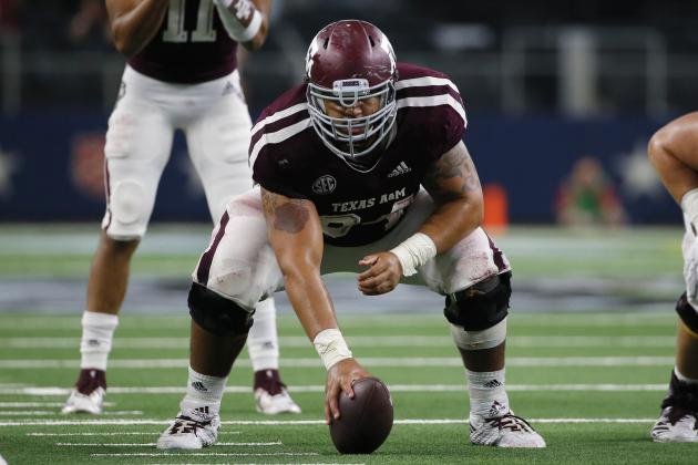 Texas A&M Aggies center Erik McCoy (center) waits to snap the ball to quarterback Kellen Mond (11) during the second half of an NCAA college football game against the Arkansas Razorbacks, Saturday, Sept. 29, 2018, in Arlington, Texas. (AP Photo/Roger Steinman)