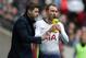 Tottenham Hotspur's Argentinian head coach Mauricio Pochettino (L) speaks with Tottenham Hotspur's Danish midfielder Christian Eriksen (R) during the English Premier League football match between Tottenham Hotspur and Arsenal at Wembley Stadium in London, on March 2, 2019. (Photo by Daniel LEAL-OLIVAS / AFP) / RESTRICTED TO EDITORIAL USE. No use with unauthorized audio, video, data, fixture lists, club/league logos or 'live' services. Online in-match use limited to 120 images. An additional 40 images may be used in extra time. No video emulation. Social media in-match use limited to 120 images. An additional 40 images may be used in extra time. No use in betting publications, games or single club/league/player publications. / (Photo credit should read DANIEL LEAL-OLIVAS/AFP/Getty Images)
