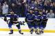 St. Louis Blues' Alex Pietrangelo (27), Vladimir Tarasenko (91) and Brayden Schenn (10) skate back to the bench after celebrating a goal by Tarasenko against the Dallas Stars during the second period in Game 1 of an NHL second-round hockey playoff series Thursday, April 25, 2019, in St. Louis. (AP Photo/Jeff Roberson)