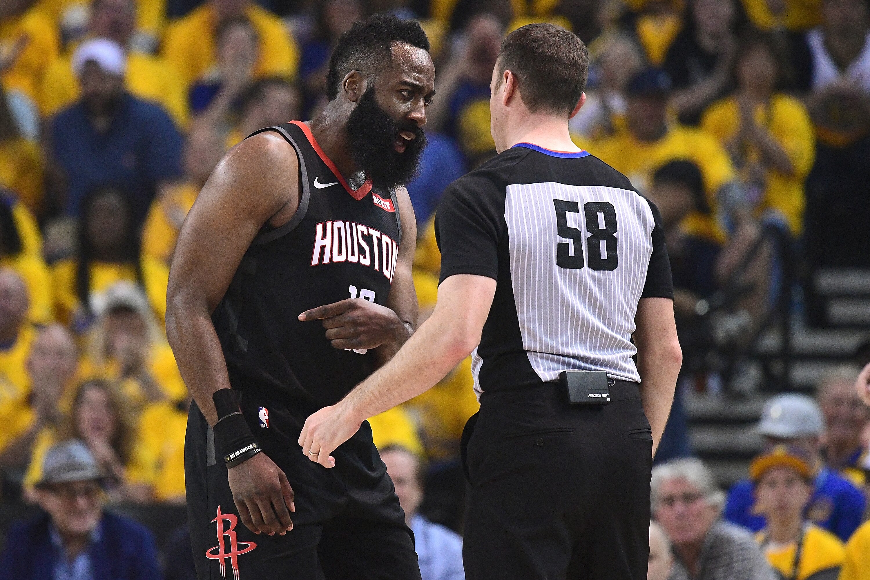 OAKLAND, CA - APRIL 28:  James Harden #13 of the Houston Rockets complains over a foul call on him against the Golden State Warriors to referee Josh Tiven #58 during Game One of the Second Round of the 2019 NBA Western Conference Playoffs at ORACLE Arena on April 28, 2019 in Oakland, California. NOTE TO USER: User expressly acknowledges and agrees that, by downloading and or using this photograph, User is consenting to the terms and conditions of the Getty Images License Agreement.  (Photo by Thearon W. Henderson/Getty Images)
