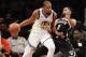 Brooklyn Nets' Spencer Dinwiddie (8) defends against Golden State Warriors' Kevin Durant (35) during the second half of an NBA basketball game Sunday, Oct. 28, 2018, in New York. (AP Photo/Frank Franklin II)