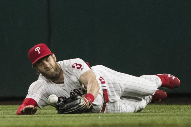 Philadelphia Phillies right fielder Bryce Harper drops a ball hit by the Detroit Tigers' Niko Goodrum during the eighth inning of a baseball game, Tuesday, April 30, 2019, in Philadelphia. The Tigers won 3-1. (AP Photo/Matt Rourke)