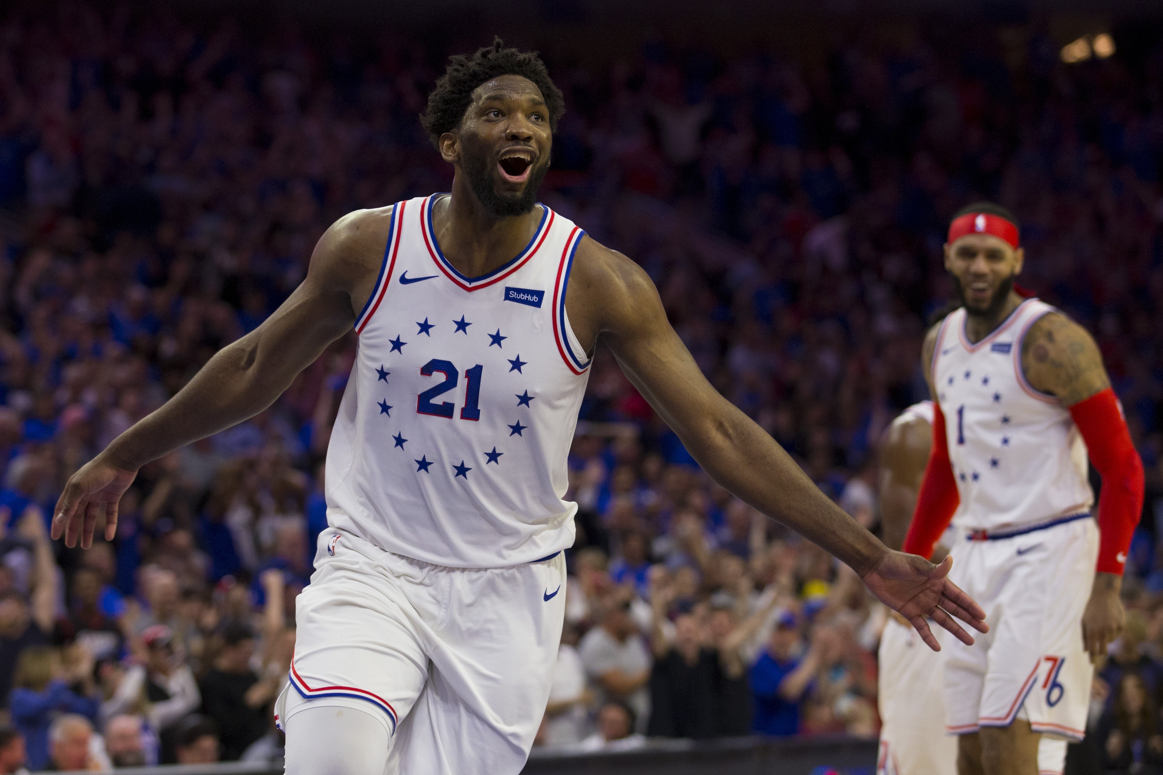 PHILADELPHIA, PA - MAY 02: Joel Embiid #21 of the Philadelphia 76ers reacts after a dunk by Mike Scott #1 against the Toronto Raptors in the fourth quarter of Game Three of the Eastern Conference Semifinals at the Wells Fargo Center on May 2, 2019 in Philadelphia, Pennsylvania. The 76ers defeated the Raptors 116-95. NOTE TO USER: User expressly acknowledges and agrees that, by downloading and or using this photograph, User is consenting to the terms and conditions of the Getty Images License Agreement. (Photo by Mitchell Leff/Getty Images)