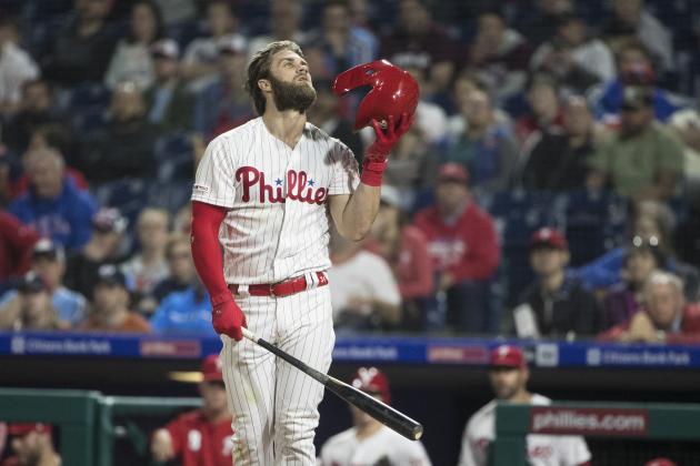 Philadelphia Phillies' Bryce Harper replaces his helmet after taking a swing during baseball game against the Detroit Tigers, Tuesday, April 30, 2019, in Philadelphia. (AP Photo/Matt Rourke)