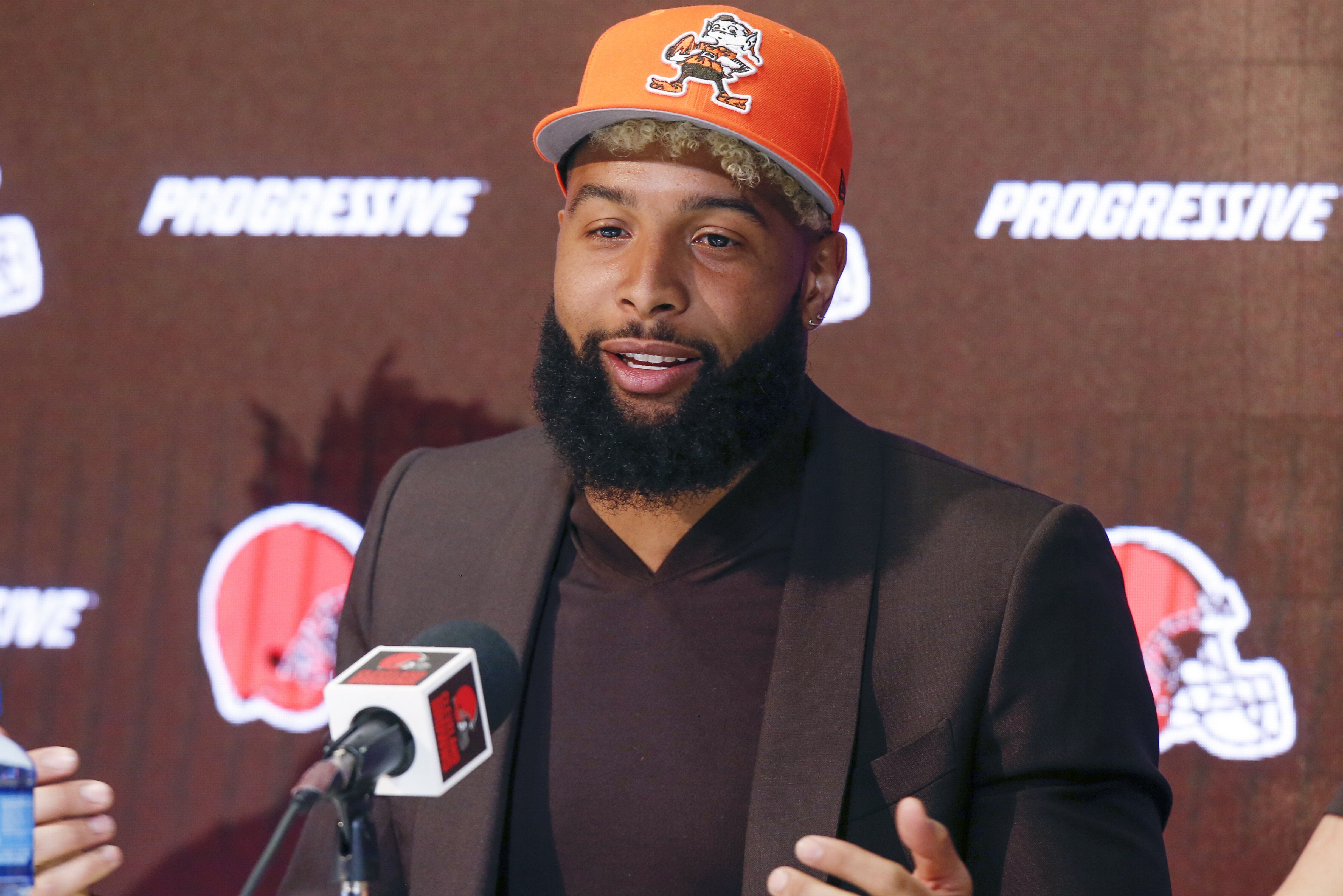 In this April 1, 2019 photo Cleveland Browns' Odell Beckham answers questions during a news conference in Berea, Ohio. Browns coach Freddie Kitchens says he’s not upset with star receiver Odell Beckham’s absence from the team’s voluntary offseason workout program. (AP Photo/Ron Schwane)