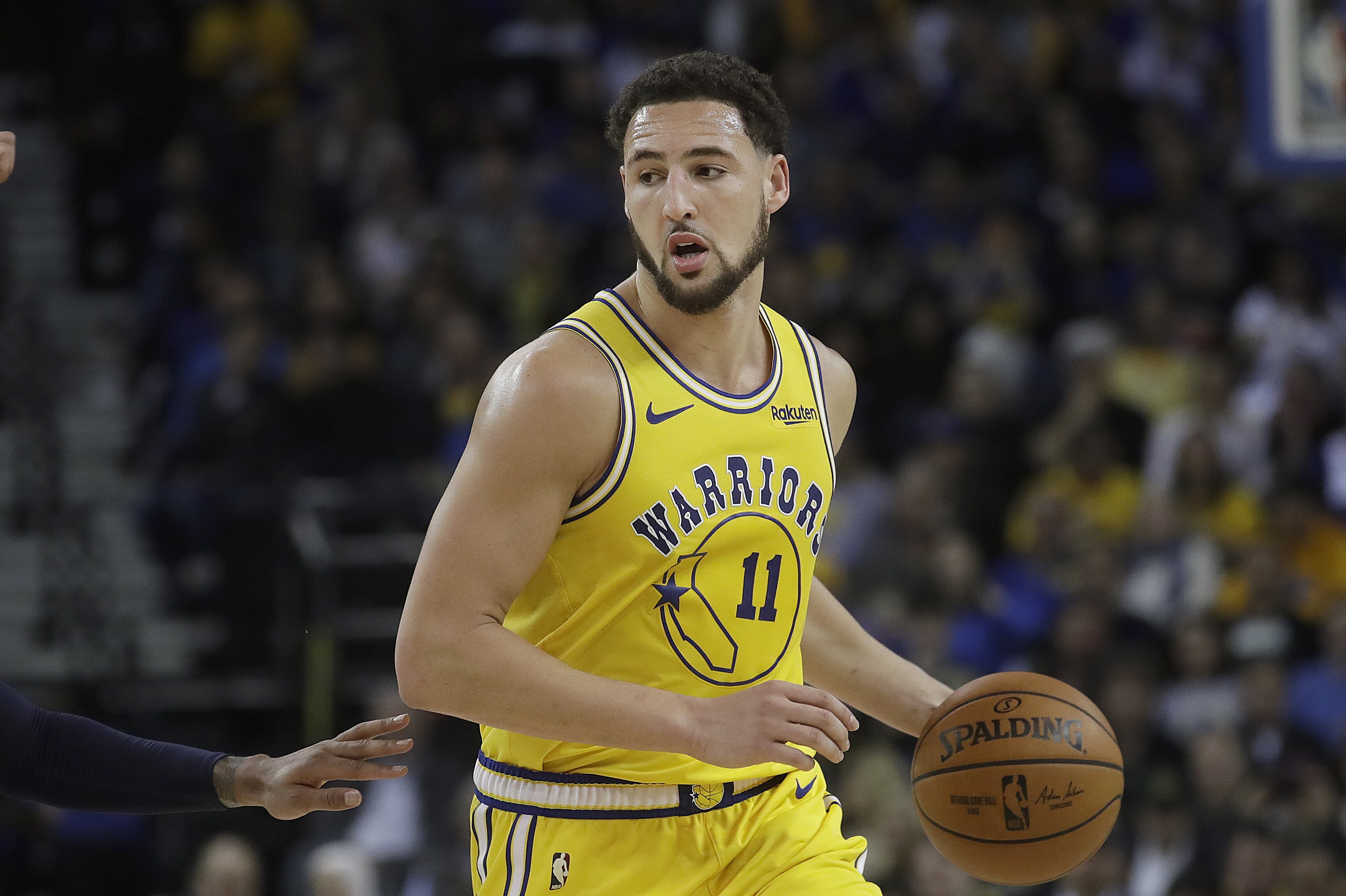 Golden State Warriors guard Klay Thompson (11) against the Denver Nuggets during an NBA basketball game in Oakland, Calif., Tuesday, April 2, 2019. (AP Photo/Jeff Chiu)