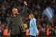 Manchester City's Spanish manager Pep Guardiola salutes the crowd after the final whistle of the English Premier League football match between Manchester City and Leicester City at the Etihad Stadium in Manchester, north west England, on May 6, 2019. (Photo by Paul ELLIS / AFP) / RESTRICTED TO EDITORIAL USE. No use with unauthorized audio, video, data, fixture lists, club/league logos or 'live' services. Online in-match use limited to 120 images. An additional 40 images may be used in extra time. No video emulation. Social media in-match use limited to 120 images. An additional 40 images may be used in extra time. No use in betting publications, games or single club/league/player publications. / (Photo credit should read PAUL ELLIS/AFP/Getty Images)