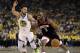 Chris Paul of the Houston Rockets, right, heads the ball against Stephen Curry (30) of the Golden State Warriors in the first half of the fifth game of a second round NBA basketball playoff series, on Wednesday, May 8, 2019, in Oakland, California (). AP Photo / Ben Margot)