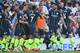 Manchester City's Algerian midfielder Riyad Mahrez (2R) celebrates scoring their third goal during the English Premier League football match between Brighton and Hove Albion and Manchester City at the American Express Community Stadium in Brighton, southern England on May 12, 2019. (Photo by Glyn KIRK / AFP) / RESTRICTED TO EDITORIAL USE. No use with unauthorized audio, video, data, fixture lists, club/league logos or 'live' services. Online in-match use limited to 120 images. An additional 40 images may be used in extra time. No video emulation. Social media in-match use limited to 120 images. An additional 40 images may be used in extra time. No use in betting publications, games or single club/league/player publications. / (Photo credit should read GLYN KIRK/AFP/Getty Images)